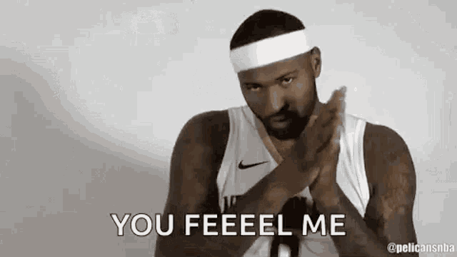a basketball player wearing a headband is saying `` you feeeel me '' while clapping his hands .