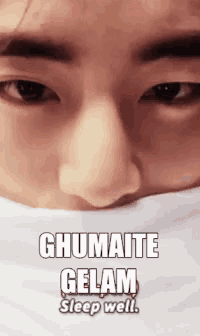 a close up of a man 's face with a white scarf around his neck and the words ghumate gelam sleep well .