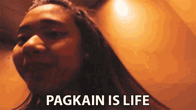 a woman is smiling and saying pagkain is life