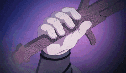 a person 's hand is holding a purple object with a purple background