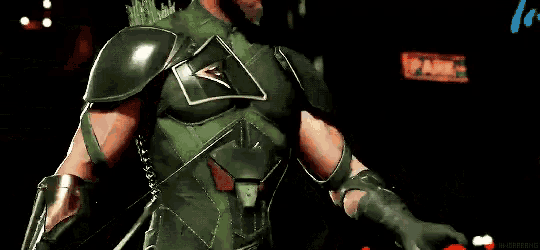 a man in a green superhero costume is eating an apple .