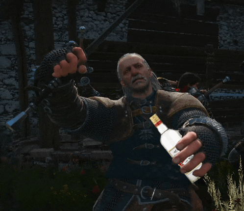 a man with a beard is holding a bottle of alcohol
