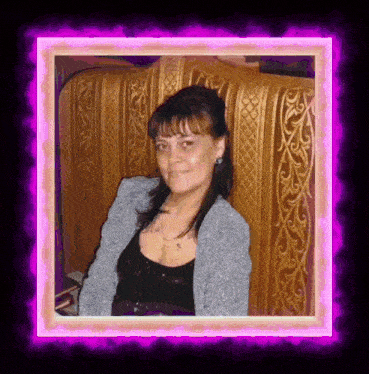 a woman is sitting in a chair with a pink border around her