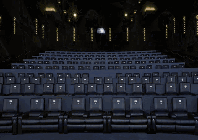 a row of blue bean bag chairs with the word movie written on them