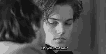 a man in a tuxedo is looking at another man in a black and white photo and says `` do you love me ? ''