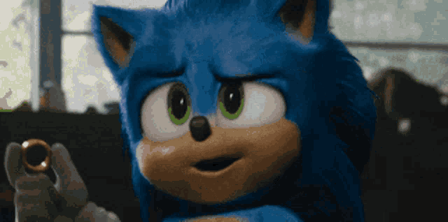 a close up of a cartoon character holding a ring