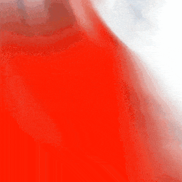a blurry picture of a red object with a white background