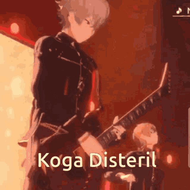 a man is playing a guitar on a stage with the words koga disteril written on the bottom .