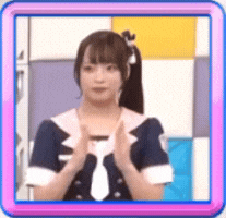 a girl in a sailor dress and tie is standing in a pink frame .
