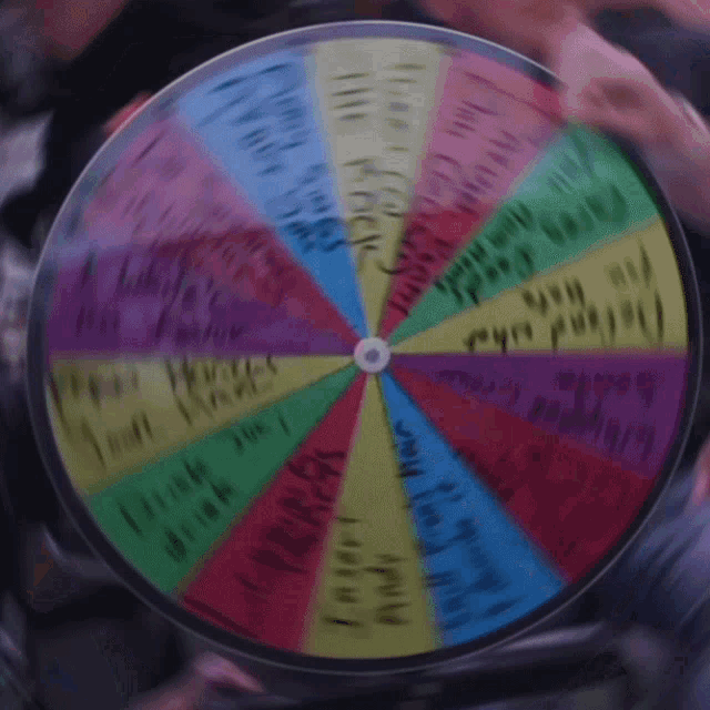 a colorful spinning wheel with the words " i love you " in the center