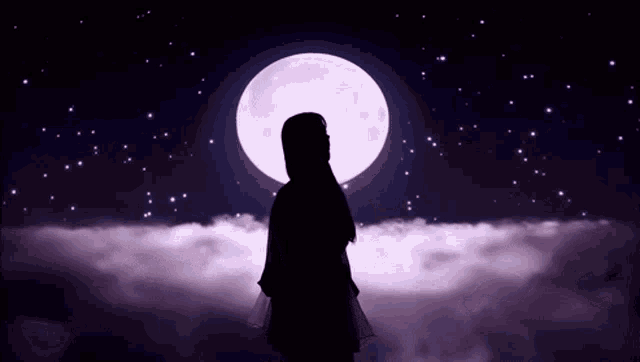 a silhouette of a woman standing in front of a full moon