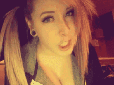 a girl with pigtails and piercings on her ears
