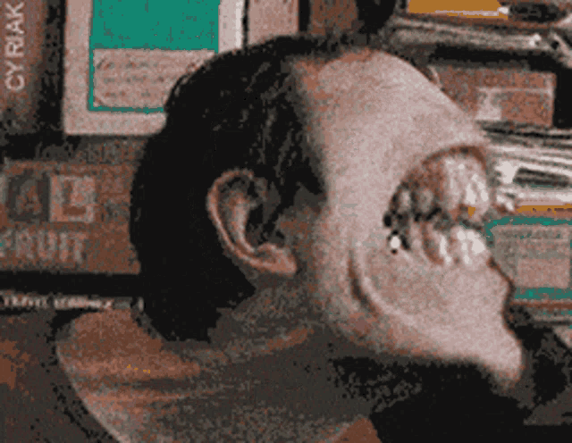 a blurry picture of a man 's face with the word fruit on the bottom