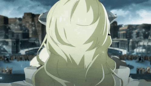 a woman with long blonde hair is standing in front of a crowd