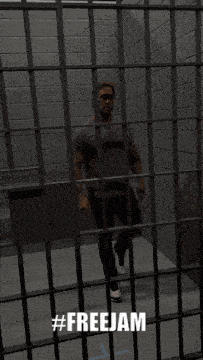a man behind bars in a jail cell with the hashtag #freejam above him