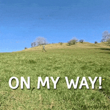 a person running on a hill with the words on my way