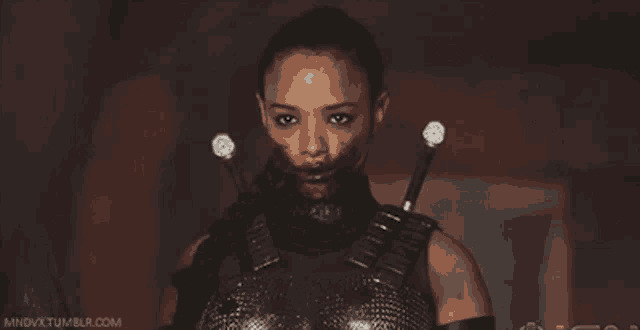 a woman with blood on her face and the words mindvx tumblr.com on the bottom right