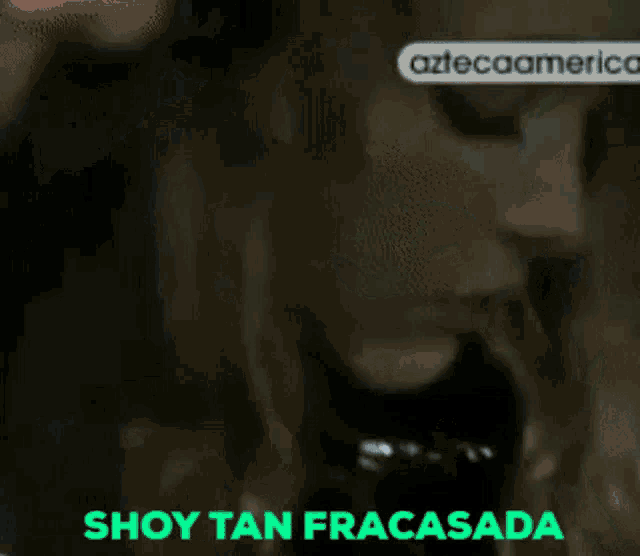a close up of a woman 's face with the words tengo exito below her