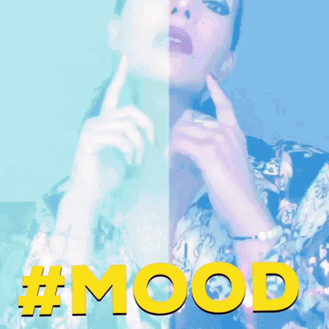 a woman with a tattoo of a cross on her wrist is wearing a shirt with the word mood on it