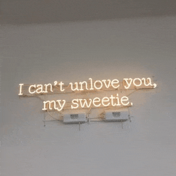 a neon sign that says i can t unlove you my sweetie