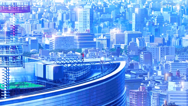 a couple standing on top of a very tall building