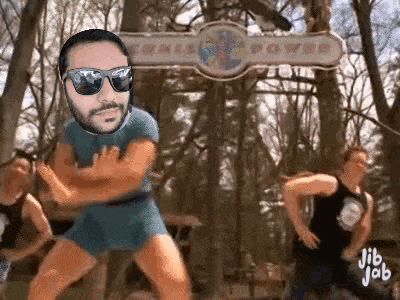 a man wearing sunglasses and shorts is dancing in front of a sign that says power