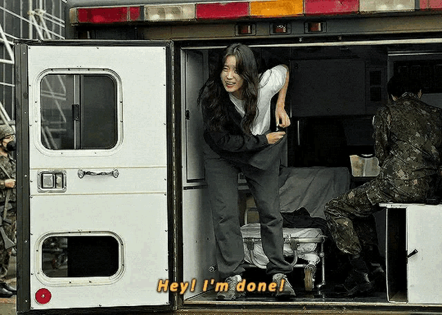 a woman getting out of an ambulance with the words hey i 'm done