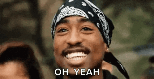 a man wearing a bandana and a hat is smiling and saying `` oh yeah '' .