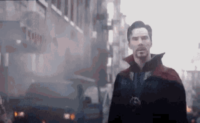 doctor strange is walking down a city street in a foggy day .