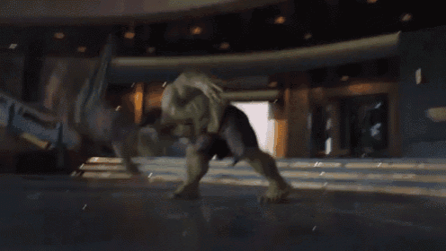 a hulk is standing in a room with stairs