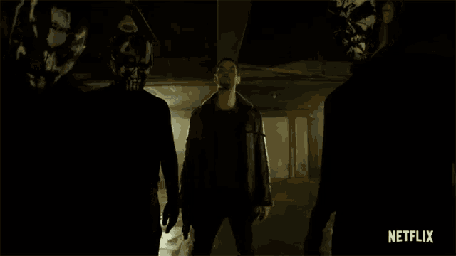 a man in a leather jacket is standing in a dark room with netflix written on the bottom