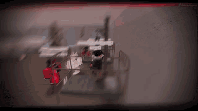 a blurry picture of a man sitting in a chair