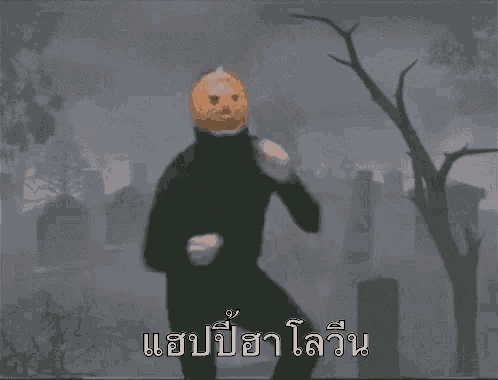 a man with a pumpkin on his head is standing in a cemetery .