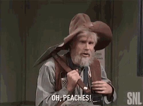 a man with a beard is wearing a cowboy hat and holding a shovel and saying oh peaches .