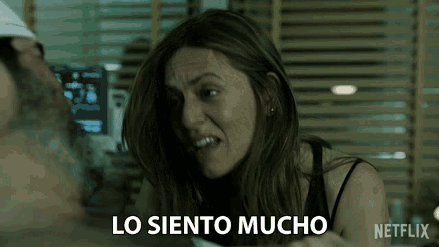 a woman says lo siento mucho next to a man in a hospital bed