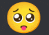 a close up of a smiley face with its tongue out .