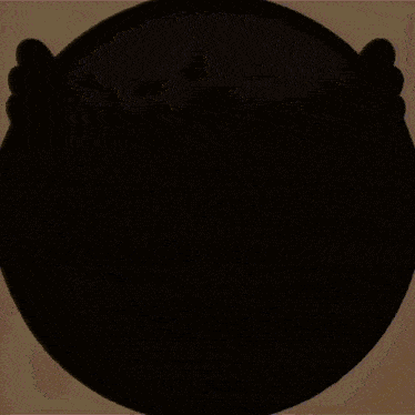 a blurred image of a m2c logo on a brown background