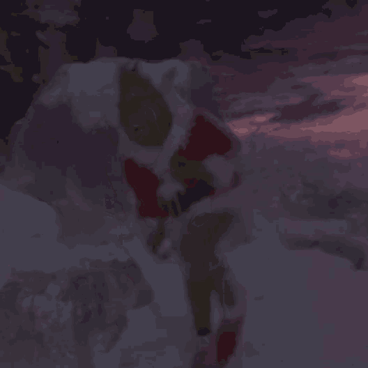 a blurred image of a person in a santa suit