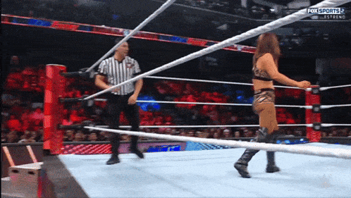 a woman in a wrestling ring with the words fox sports 2 on the bottom