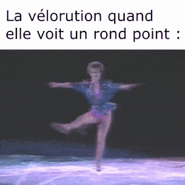 a blurred image of a female ice skater with the words la velorution quand elle voit un rond point below her