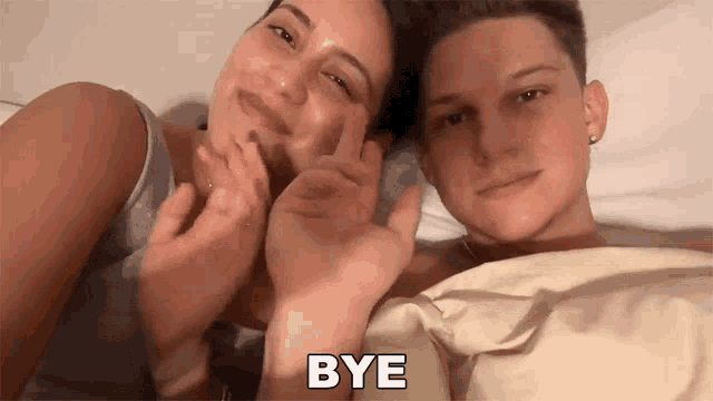 a man and a woman are laying on a bed with the words bye written on the bottom