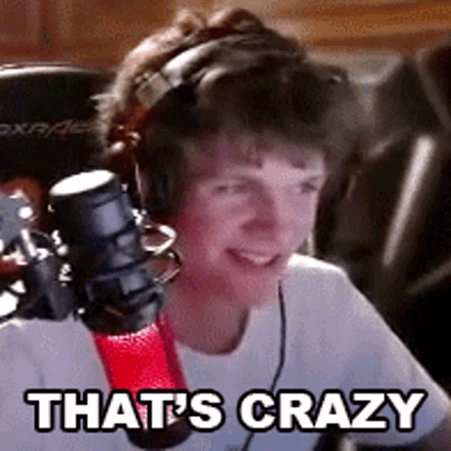 a young boy wearing headphones and a microphone says that 's crazy