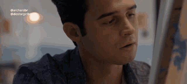 a close up of a man 's face with the words archersbr on the bottom right