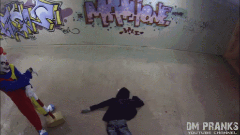 a youtube channel called dm pranks shows a clown and a man laying on the ground