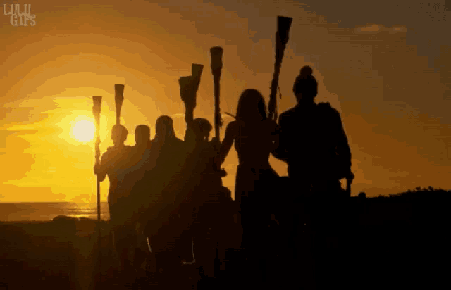 a group of people standing in front of a sunset with the words lulu girls on the bottom left
