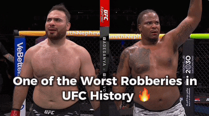 two men standing next to each other in a cage with the words one of the worst robberies in ufc history
