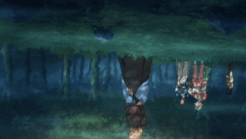 a group of people standing upside down in a forest