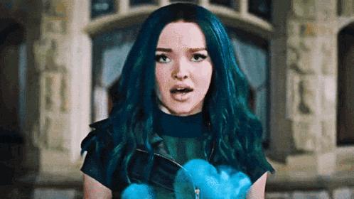 a girl with blue hair is standing in front of a building .