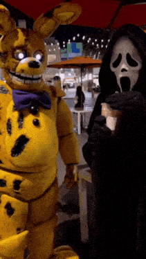 a grim reaper standing next to a yellow bunny