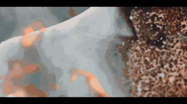 a close up of a person 's face with flames behind it